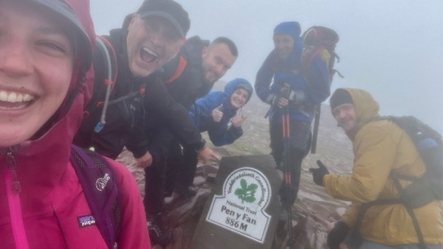 Colleagues climbing Pen Y Fan